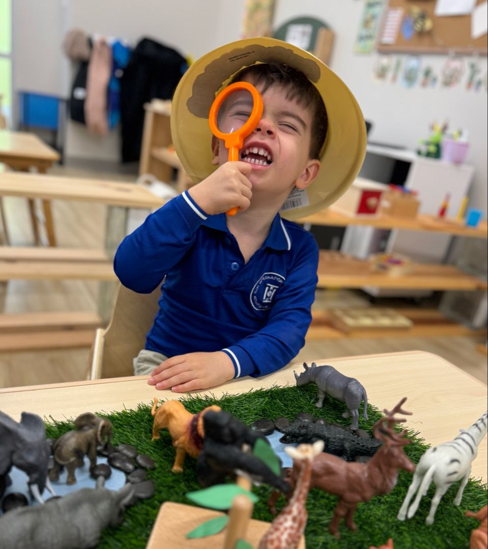 Student exploring with a magnifying glass